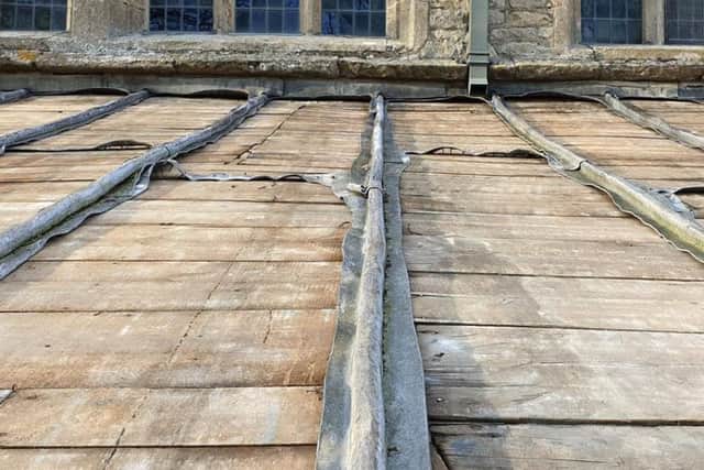 Bare boards where the lead was stripped from Navenby Church roof. EMN-191103-180900001
