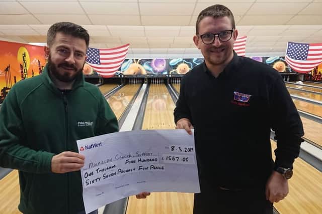 Jamie Davenport, Lincolnshires Macmillan Fundraising manager receives the cheque from Kevin Stephenson Assistant Manager of Skegness Bowl . ANL-191203-080029001