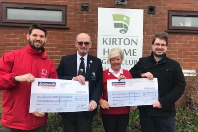 Pictured are Gary Burr, of the British Heart Foundation, and the Alzheimers Associations Oliver Larkin receiving their cheques from 2018 Captain Barry Hunt and Ladiess. Captain Marlene Morris.