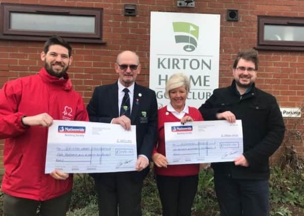 Pictured are Gary Burr, of the British Heart Foundation, and the Alzheimers Associations Oliver Larkin receiving their cheques from 2018 Captain Barry Hunt and Ladiess. Captain Marlene Morris.