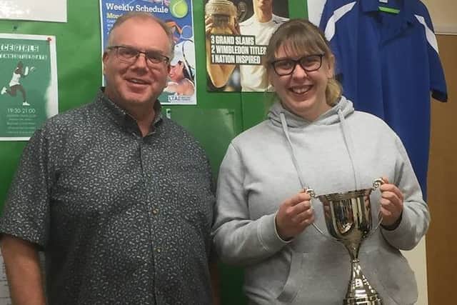 Samantha Ellis-Woods is presented with the Interflora Cup by Sleaford Tennis Club chairman Stuart Clegg EMN-190313-190715002
