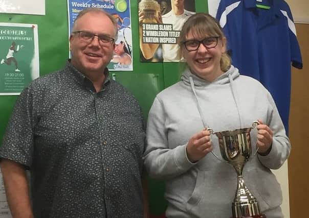 Samantha Ellis-Woods is presented with the Interflora Cup by Sleaford Tennis Club chairman Stuart Clegg EMN-190313-190715002