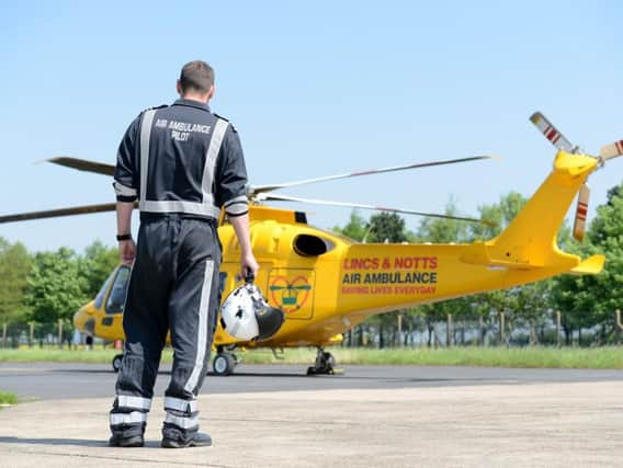 A Lincs and Notts Air Ambulance pilot preparing at base.