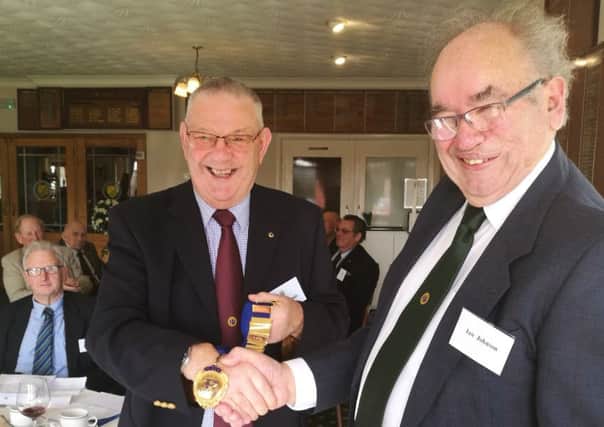 Outgoing President Ian Johnson, right, handed over the chain of office to incoming President Richard Lewis EMN-190316-235722001