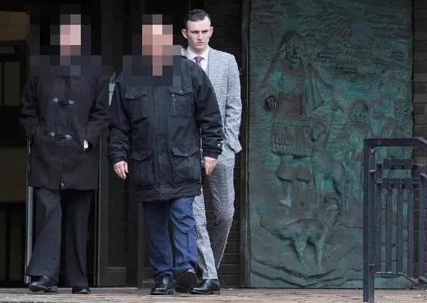 Royal Navy rating Kyle Catmull, 21, leaving Portsmouth Crown Court with his parents on Thursday (March 14) after avoiding jail for attempting to meet a 15-year-old girl.