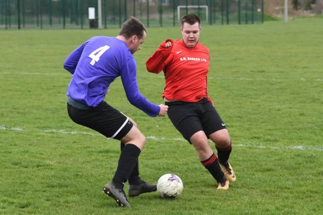 Coningsby Res (red) v Holbeach Bank. Dan Nixon