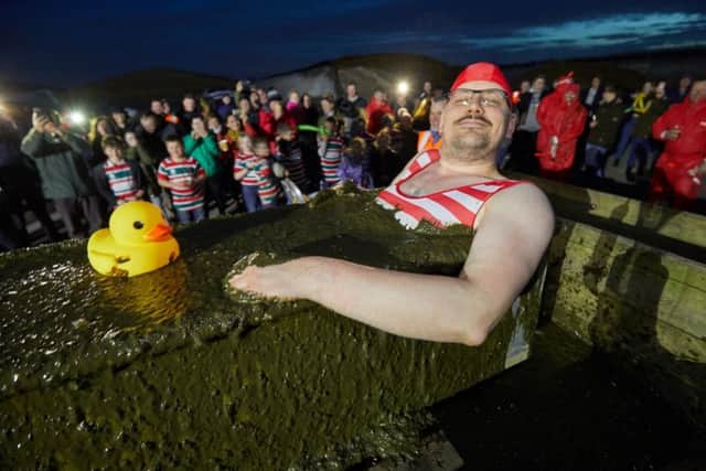 Managing Director Philipp Lukas wearing a fetching Victorian swimming costume, plunged himself in a bath brimming with digestate gunk