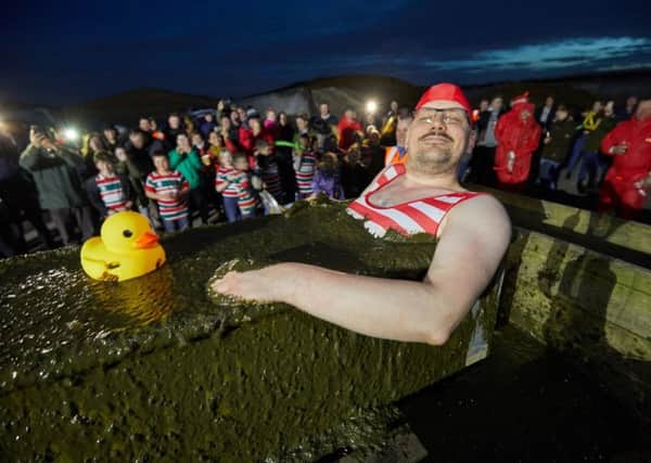 Managing Director Philipp Lukas wearing a fetching Victorian swimming costume, plunged himself in a bath brimming with digestate gunk