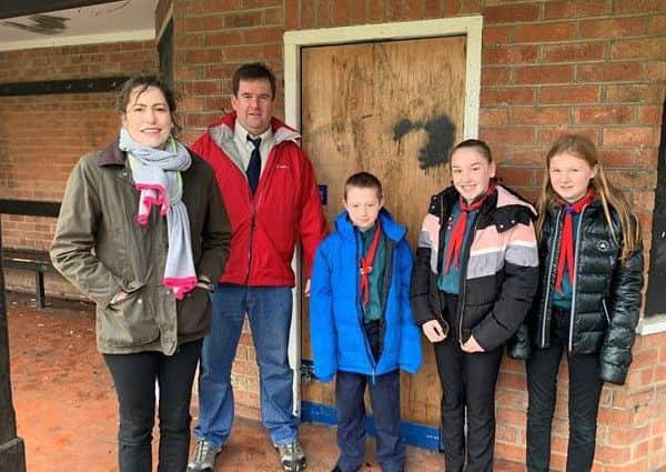 Victoria Atkins MP with Louth Scouts and their leader, Adrian Beech outside the Charles Street development. EMN-190319-130559001