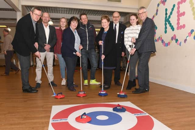 From left: James Brindle of Magna Vitae, Shaun Donnelly (parent), Rosie Graham 13, Jayne Pegg (Rotary), Karl Graham (parent), Lesley Lewis (rotary), Richard Jones (rotary), Penny Chapman, Mark Humphreys of Magna Vitae, trying New Age Kurling. EMN-190319-131308001