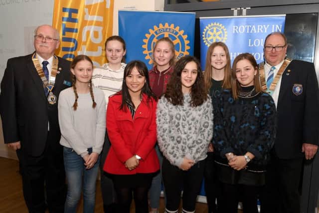 From left: Jim Randall (Rotary club of Louth, President) and Nigel Arthurs (District Governor of Rotary) with Interact members L-R Sarita Cottingham 12, Penny Chapman 12, YueYue To 18, Rosie Graham 13, Chloe Burtenshaw 13, Grace Ibbotson 12 and Grace Whitworth 17. EMN-190319-131330001