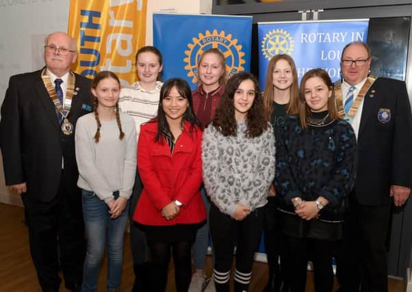 From left: Jim Randall (Rotary club of Louth, President) and Nigel Arthurs (District Governor of Rotary) with Interact members L-R Sarita Cottingham 12, Penny Chapman 12, YueYue To 18, Rosie Graham 13, Chloe Burtenshaw 13, Grace Ibbotson 12 and Grace Whitworth 17. EMN-190319-131330001