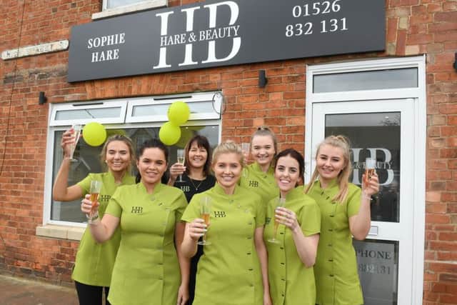 Hare and Beauty move to new premises. L-R Libby Edwards, Sophie Parslow, Amanda Hare, Sophie Hare - owner, Maisie Cox, Amy Taylor, Brooke Sorrell. EMN-190318-091253001
