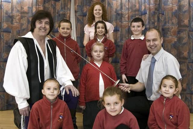 Skegness Junior School 10 years ago. Pictured were (back) chairman of Skegness Musical Theatre Society Lizzie Carroll; (second row, from left) Josef White, Jaime-Leigh Benson and Dylan Cudworth; (third row, from left) Pirate King Doug Smith, Millie Ward and assistant head teacher Philip Allen; front (from left) Lexi Cunliffe, Emma Russell and Nickita Wood. Not pictured Summer Sloan.