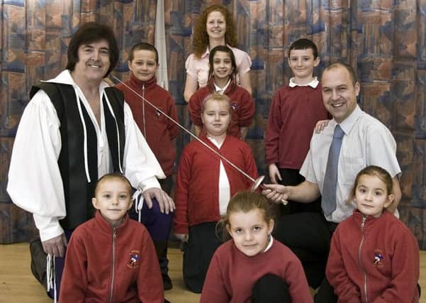 Skegness Junior School 10 years ago. Pictured were (back) chairman of Skegness Musical Theatre Society Lizzie Carroll; (second row, from left) Josef White, Jaime-Leigh Benson and Dylan Cudworth; (third row, from left) Pirate King Doug Smith, Millie Ward and assistant head teacher Philip Allen; front (from left) Lexi Cunliffe, Emma Russell and Nickita Wood. Not pictured Summer Sloan.