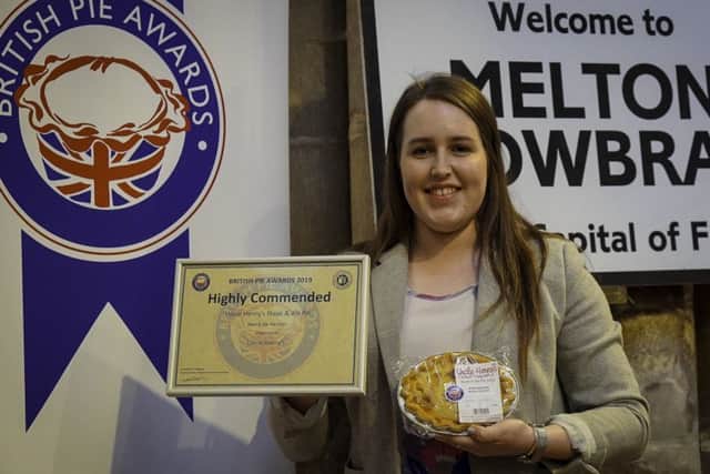 Elizabeth Jones, Uncle Henrys resident Harper student, with the winning pie and award certificate