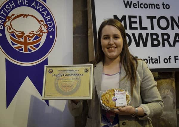 Elizabeth Jones, Uncle Henrys resident Harper student, with the winning pie and award certificate