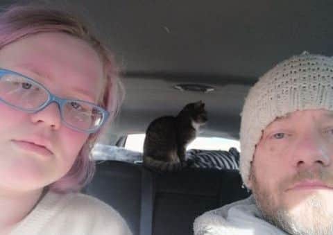 Sherelyn Russell and Tony Pigram in the car they shared with their cat. ANL-190325-115139001