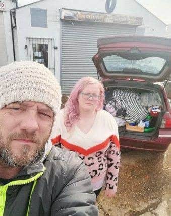 Sherelyn Russell and Tony Pigram with their possessions in their car. ANL-190325-115209001