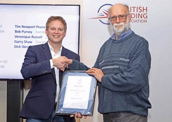 Dick Skerry (right) received the British Gliding Association Diploma Award for Services to Gliding. It was presented by Grant Shapps MP (left), the chairman of the General Aviation All-Party Parliamentary Group. (Photo: Paul Morrison).