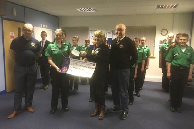 From left - Lion Marcus Griffen, and receving the cheque on behalf of the Cadets is Cadet Corporal Jazmyne Evans, the Cadet of the year for Lincolnshire and Nottinghamshire, Lion President Sue La Roche is presenting the cheque with Lion Mick Lawes. EMN-190326-141341001