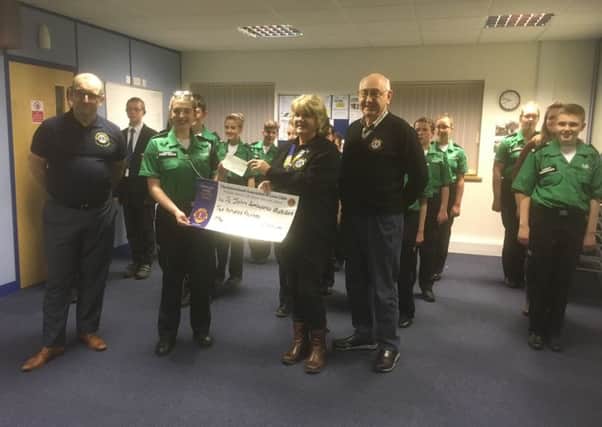 From left - Lion Marcus Griffen, and receving the cheque on behalf of the Cadets is Cadet Corporal Jazmyne Evans, the Cadet of the year for Lincolnshire and Nottinghamshire, Lion President Sue La Roche is presenting the cheque with Lion Mick Lawes. EMN-190326-141341001