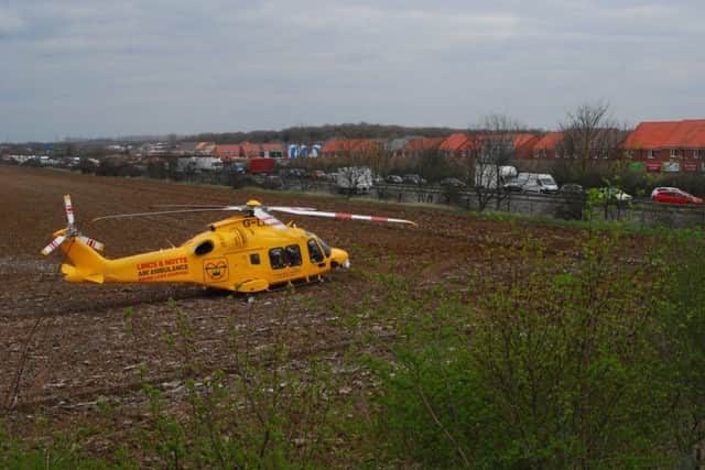The air ambulance landed in a nearby field to provide assistance. EMN-190327-152640001