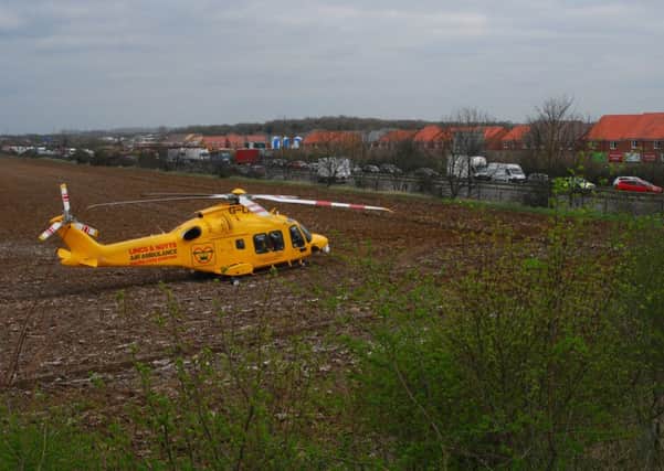 The air ambulance landed in a nearby field to provide assistance. EMN-190327-152640001