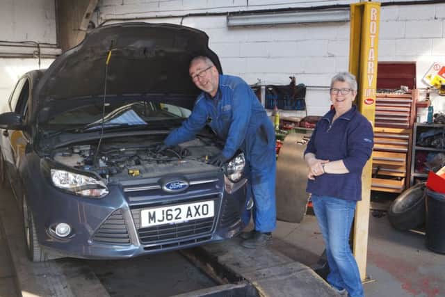 Jeff at work on the final car, watched by his wife Gill, who has done the book-keeping for the business EMN-190204-105711001