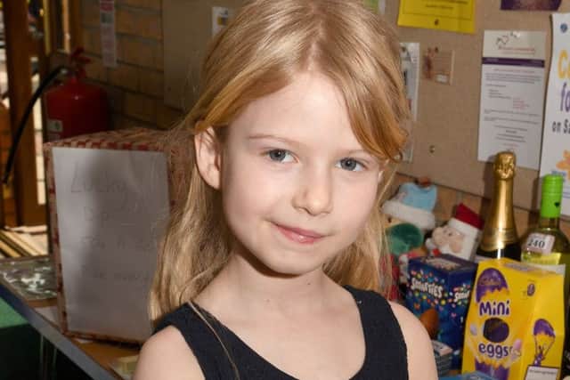 Lillyann Lees 7, doing a tombola in aid of her local Rainbows group. Nominee for Town Awards. EMN-190204-152756001