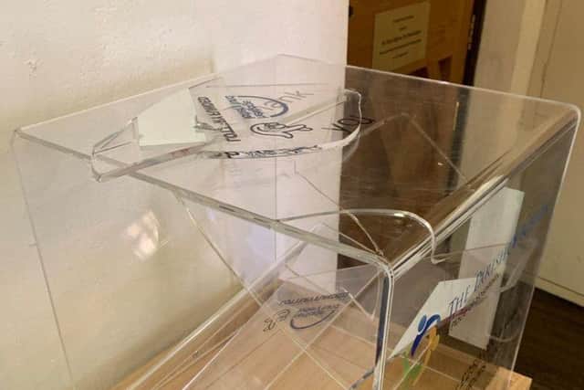 The smashed open donation box at the Stump