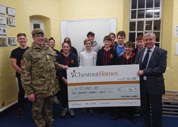 Mike Lewis, Company Sargent Major for the Lincoln Army Cadets No 1 company with David Newton, Managing Director of Chestnut Homes, and a few of the cadets. EMN-190330-224332001