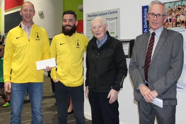 Louth Triathlon Club chairman Martin Ball and club secretary Sean Hutchings (left) receive the funding from LSA's David Manders EMN-190104-180516002