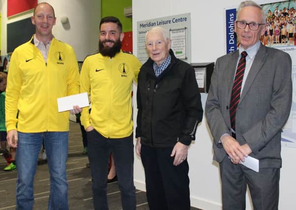 Louth Triathlon Club chairman Martin Ball and club secretary Sean Hutchings (left) receive the funding from LSA's David Manders EMN-190104-180516002