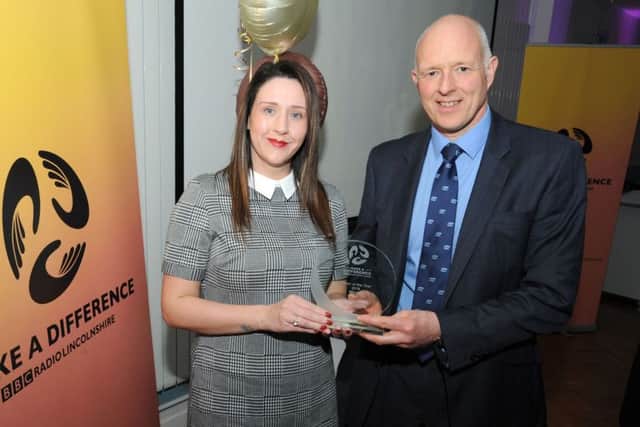 Charlotte Clarkson receiving her award from judge Steve Gelder.