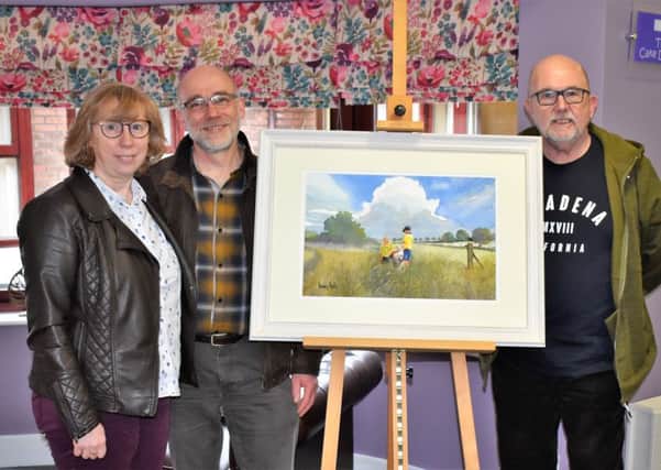 2018 Raffle winner Pauline Martin (left), husband Ian Martin and artist Dennis Nash (right) with painting.