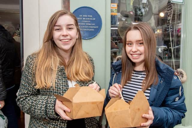 Mollie Tunnicliffe and Kirsty Allison enjoy a slice outside Meridian Meats.