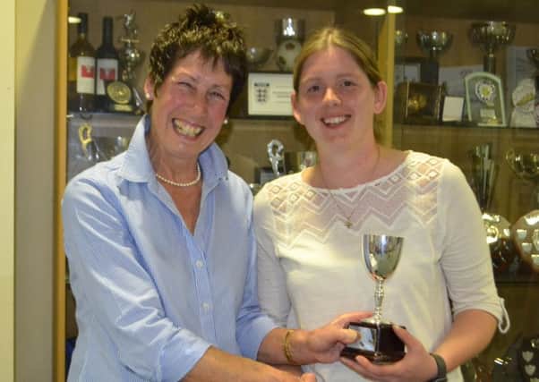 Amie Wright receives the outstanding contribution to the club award (senior) from chairwoman Lesley Ward EMN-190804-111958002