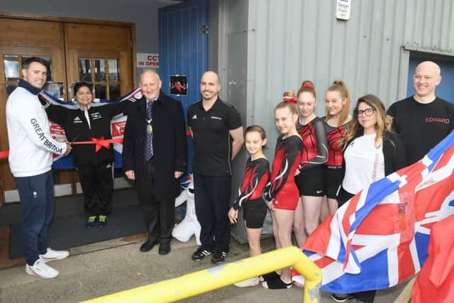 Sleaford Elite Gymnastics Club official opening of new premises with olympic gymnast Kristian Thomas and Spanish olympic trampolinist Humberto Hernandez. Kristian Thomas cutting the ribbon. EMN-190804-095724001