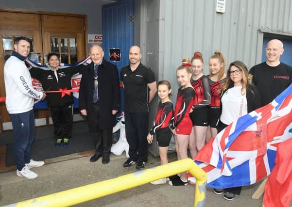Sleaford Elite Gymnastics Club official opening of new premises with olympic gymnast Kristian Thomas and Spanish olympic trampolinist Humberto Hernandez. Kristian Thomas cutting the ribbon. EMN-190804-095724001