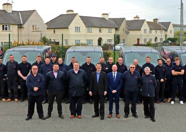 LHP chief executive Murray Macdonald (front centre) joins colleagues and members of the Boston area team, displaying the newly-liveried vans.