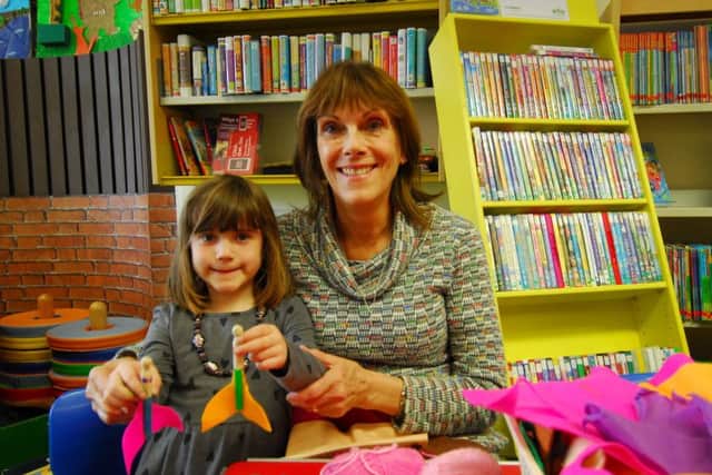 Jan Mathieson with granddaughter Celeste Mathieson-Bright making mermaid peg dolls at Sleaford Library. EMN-191204-151631001