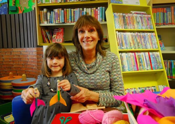Jan Mathieson with granddaughter Celeste Mathieson-Bright making mermaid peg dolls at Sleaford Library. EMN-191204-151631001