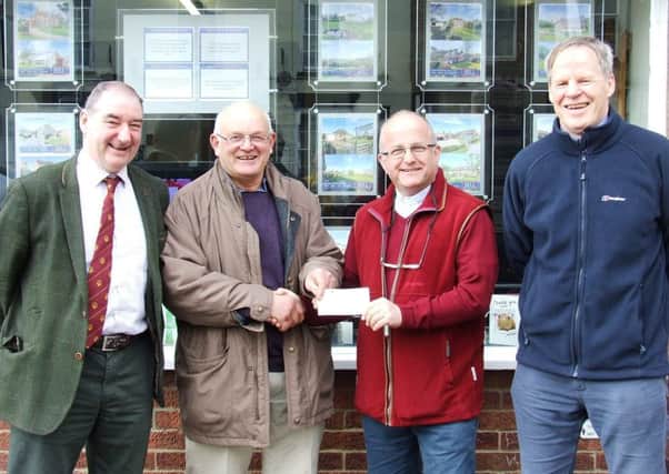 The cheque being presented by the Chairman of the Committee, Mike Harrison to the Rev Alan Robson on behalf of LRSN. Looking on are Richard Evison (Secretary) and Robert Bell (Treasurer). EMN-190416-095550001