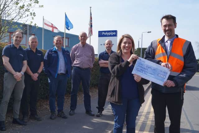 Neil Williams presented the cheque for £1,016.96 to Gemma Shaw from the Lincs & Notts Air Ambulance.