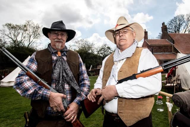 Peter 'Doc' and Paul 'Edge' Fretwell wield their weapons.