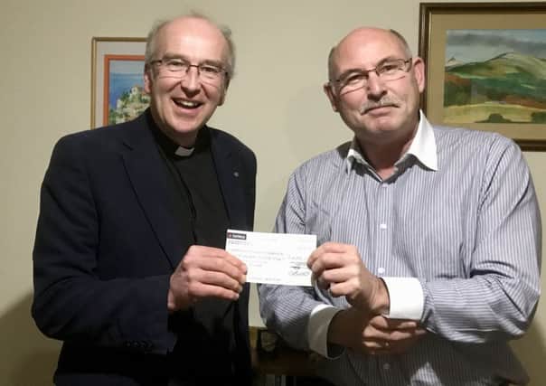 Paul Scott, Chairman of Lincolnshire Community Foundation, right, presented a cheque for £4000 to the Rev Charles Patrick, Chairman of the Horncastle Matters community magazine. EMN-190419-080846001