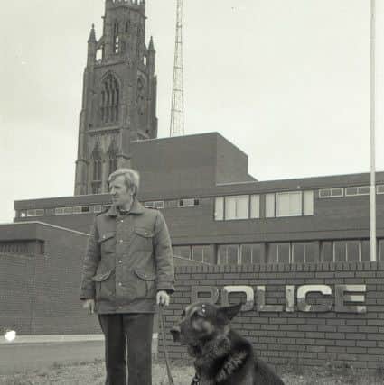 Basko, the Boston police dog which helped rescue a nine-year-old boy from a pit of pig manure in 1974, with handler PC David Mapplebeck.