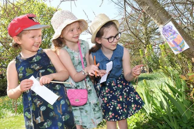 Easter egg hunt at Rauceby Hall with visits to the lambing sheds at Rauceby Hall Farm. L-R Zoey 5, Emily 7 and Darcey 8 find a clue. EMN-190422-095239001