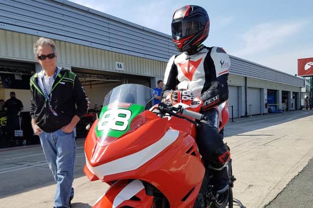 Mikey gets in the zone in the pit lane as dad Shane makes some last-minute visual checks on the bike EMN-190425-154604002